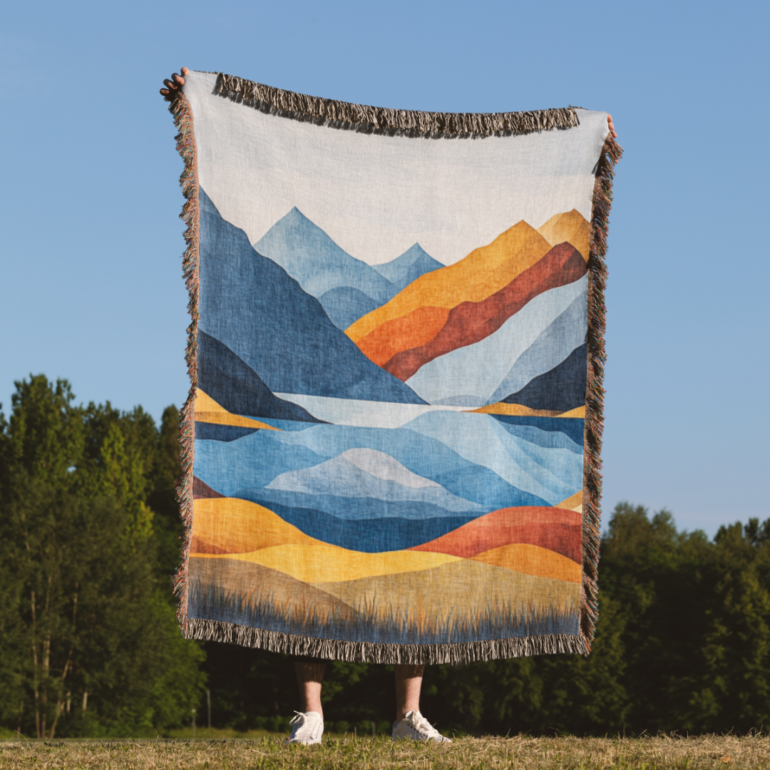 a person standing in a field holding a large blanket