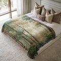 a bed with a blanket on top of it