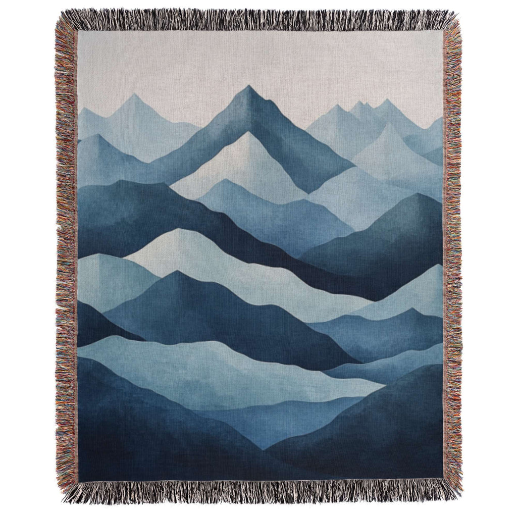 a blue and white tapestry with mountains in the background