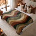 Autumn Current jacquard woven blanket on a queen bed