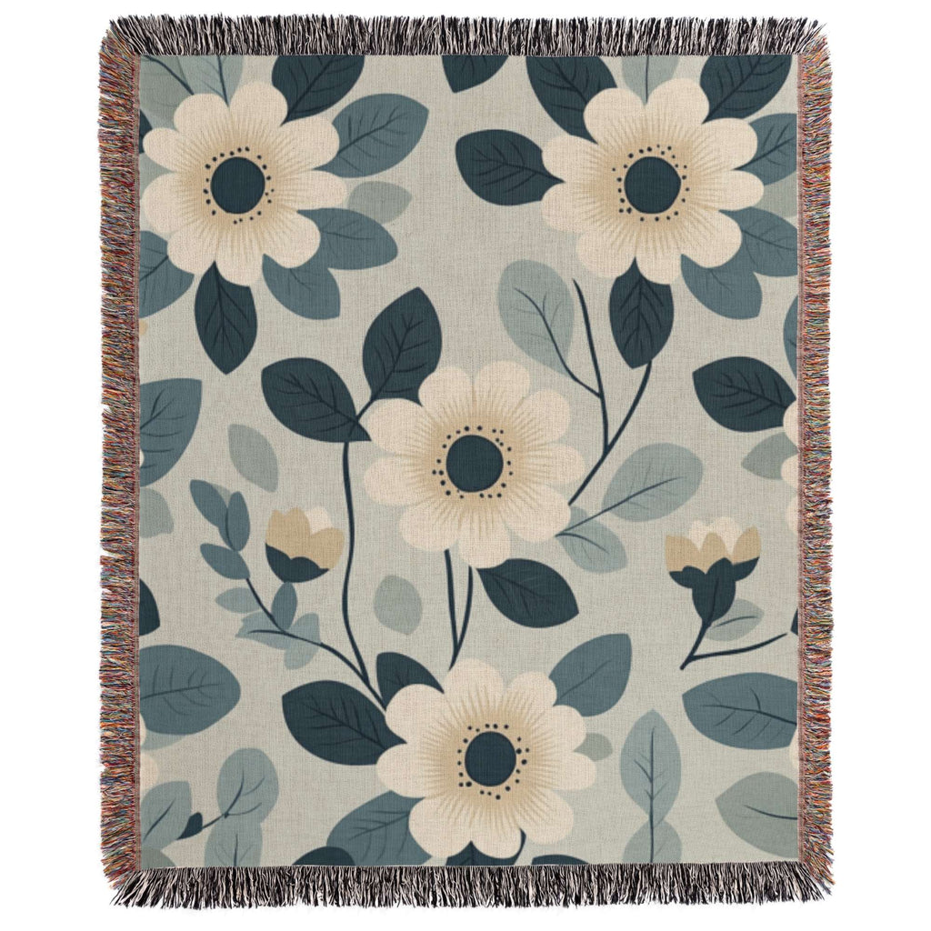 a blue and white blanket with flowers on it