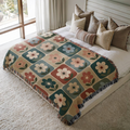 Botanical Squares jacquard woven blanket on a queen bed