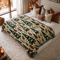 Evergreen Forest jacquard woven blanket on a queen bed