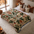 Folk Tulip jacquard woven blanket on a queen bed