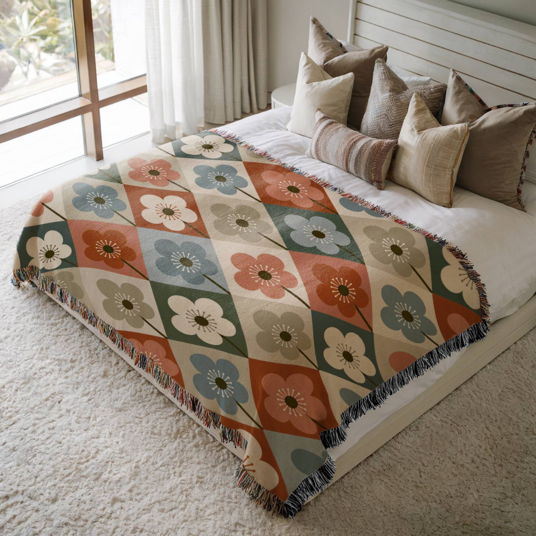 Garden Diamonds jacquard woven blanket on a queen bed