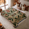 Heritage Bloom jacquard woven blanket on a queen bed