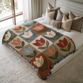Minimalist Tulips jacquard woven blanket on a queen bed