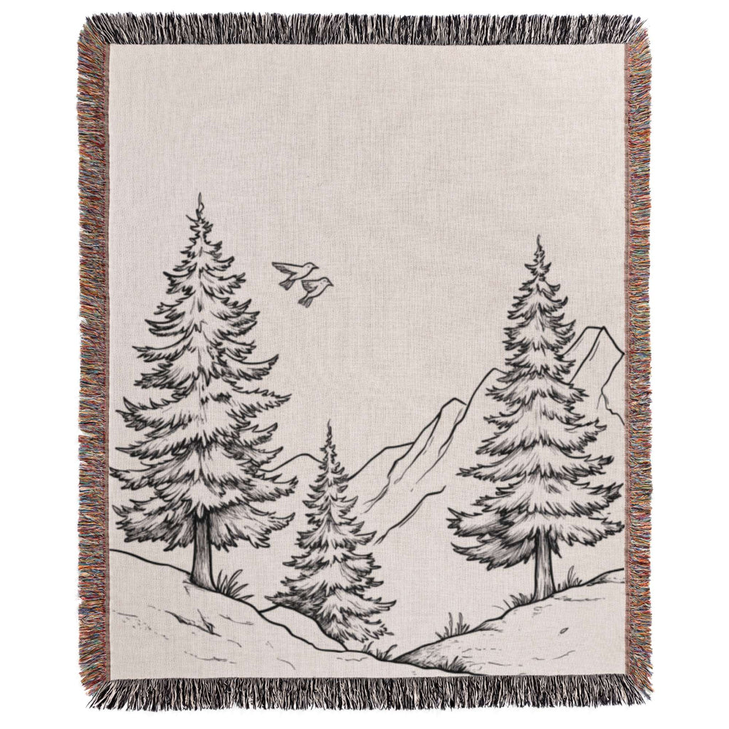 a black and white drawing of trees on a blanket