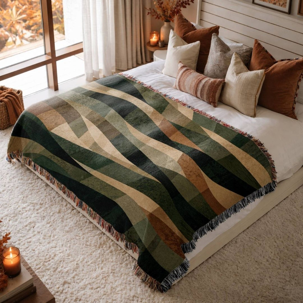 Moonlit Woodland jacquard woven blanket on a queen bed