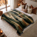 Moonlit Woodland jacquard woven blanket on a queen bed