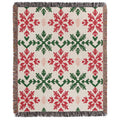 a red and green blanket with snowflakes on it