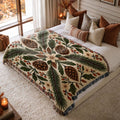 Pinecone & Spruce jacquard woven blanket on a queen bed