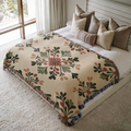 Rustic Floral Crest jacquard woven blanket on a queen bed