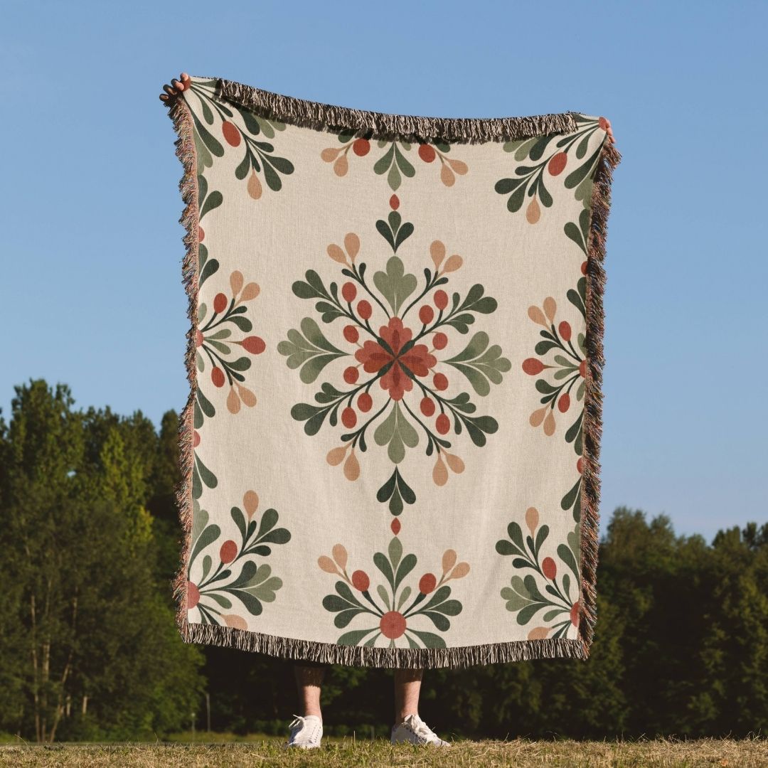 Rustic Floral Crest woven throw blanket outdoors