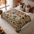 Woodland Harvest jacquard woven blanket on a queen bed
