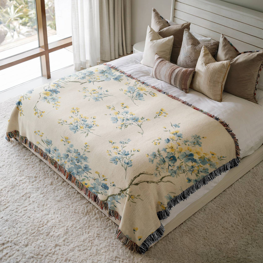 a bed with a floral comforter and pillows